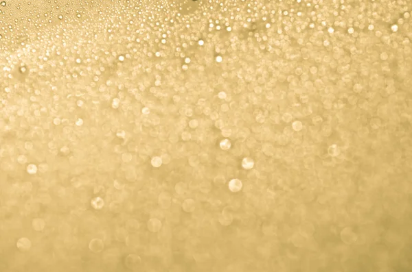Dourado abstrato brilhante desfocado fundo — Fotografia de Stock