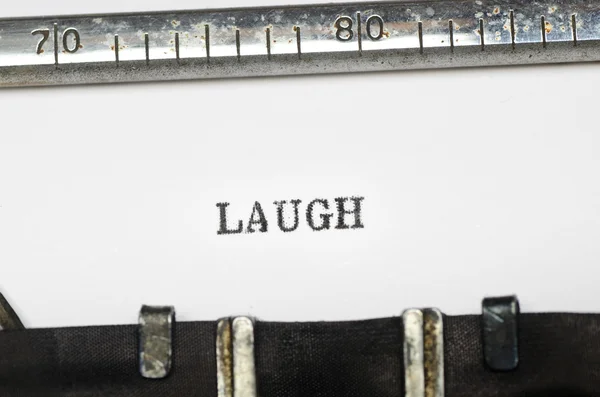 Parola risata digitata sulla macchina da scrivere — Foto Stock