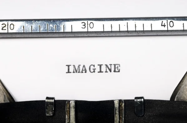 Word imagine typed on typewriter — стоковое фото