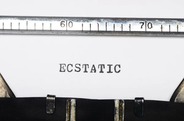 Palavra extática digitada na máquina de escrever — Fotografia de Stock
