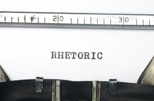 Ordet retorik skrivit på gamla skrivmaskin — Stockfoto