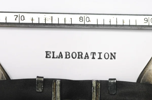 Vypracování slovo napsané na starý psací stroj — Stock fotografie