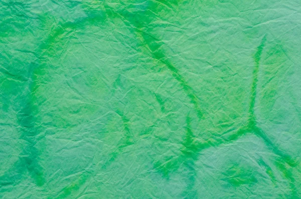 Pozadí malovaný zelený krepový papír — Stock fotografie