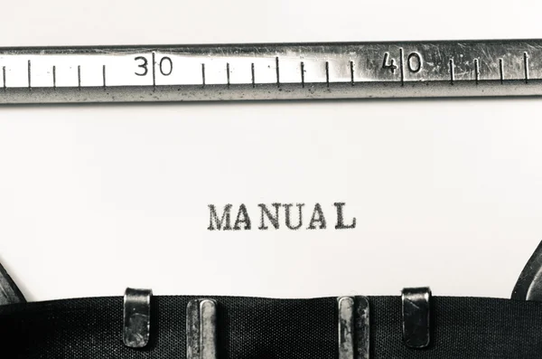Palabra manual escrito en máquina de escribir — Foto de Stock