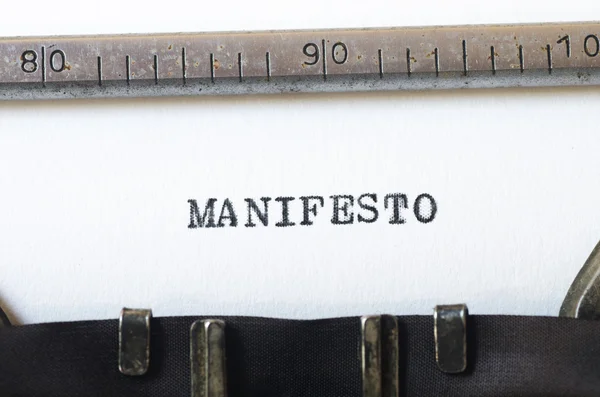 Word manifesto typed on typewriter — Stock Photo, Image