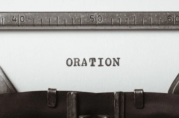 Palavra oration digitado na máquina de escrever — Fotografia de Stock