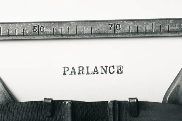 Слово parlance, введене на друкарській машинці — стокове фото