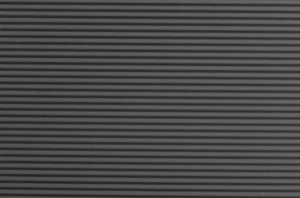 Papel cinzento ondulado textura de fundo — Fotografia de Stock