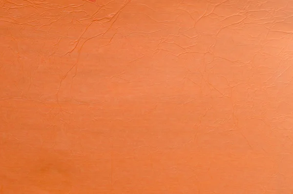Geknittertes orangefarbenes Seidenpapier Hintergrund — Stockfoto