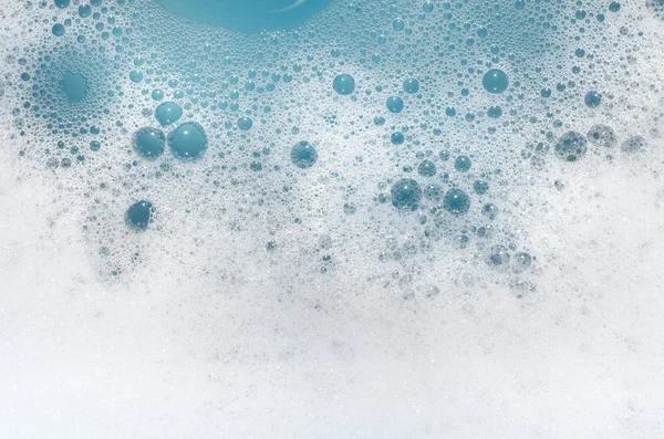 Espuma blanca sobre agua azul — Foto de Stock