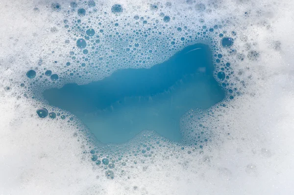 Espuma blanca sobre agua azul —  Fotos de Stock