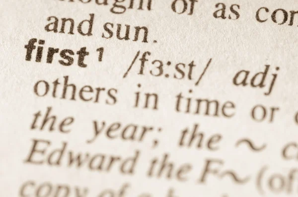 Dictionary definition of word first — Stock Photo, Image