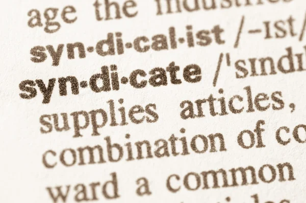 Ordbokens definition av ordet syndicate — Stockfoto