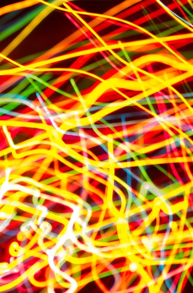 Colorful blurred motion holiday lights — Stock Photo, Image