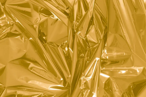 Folie de aur fundal — Fotografie, imagine de stoc