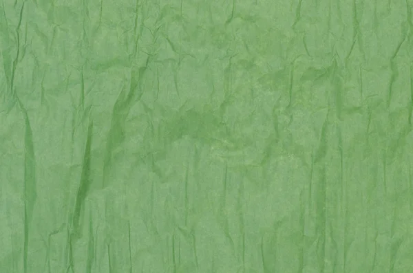 Green creased tissue paper background — Stock Photo, Image