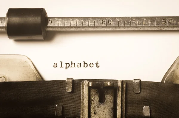 Palabra alfabeto escrito en máquina de escribir — Foto de Stock