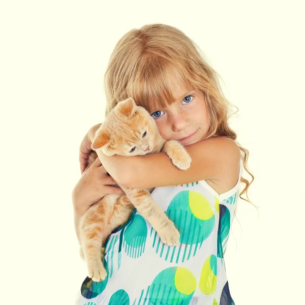 Cute girl hugging a little cat — Stock Photo, Image