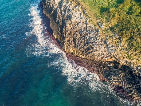 Aerial view of the rocky sea coast. The coast near the city of Buelna, Asturias, Spain