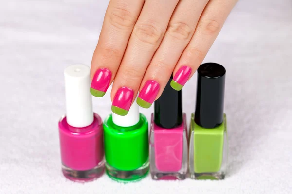 Woman's hand with  nail polishes