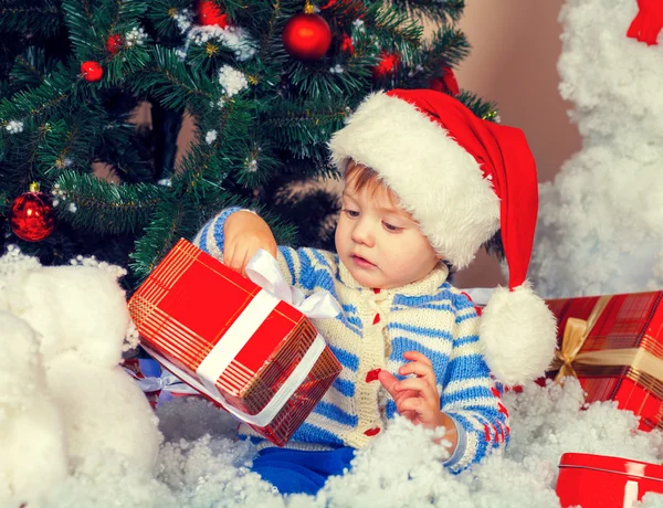 Little boy wearing Santa hat Stock Photo