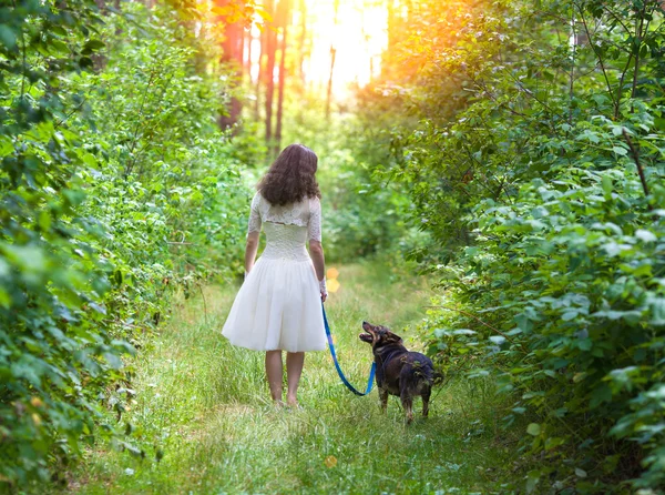 Young bride walking with dog — Stock Photo, Image