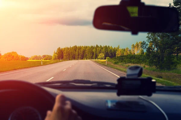 Driving a car on asphalt road — Stock Photo, Image