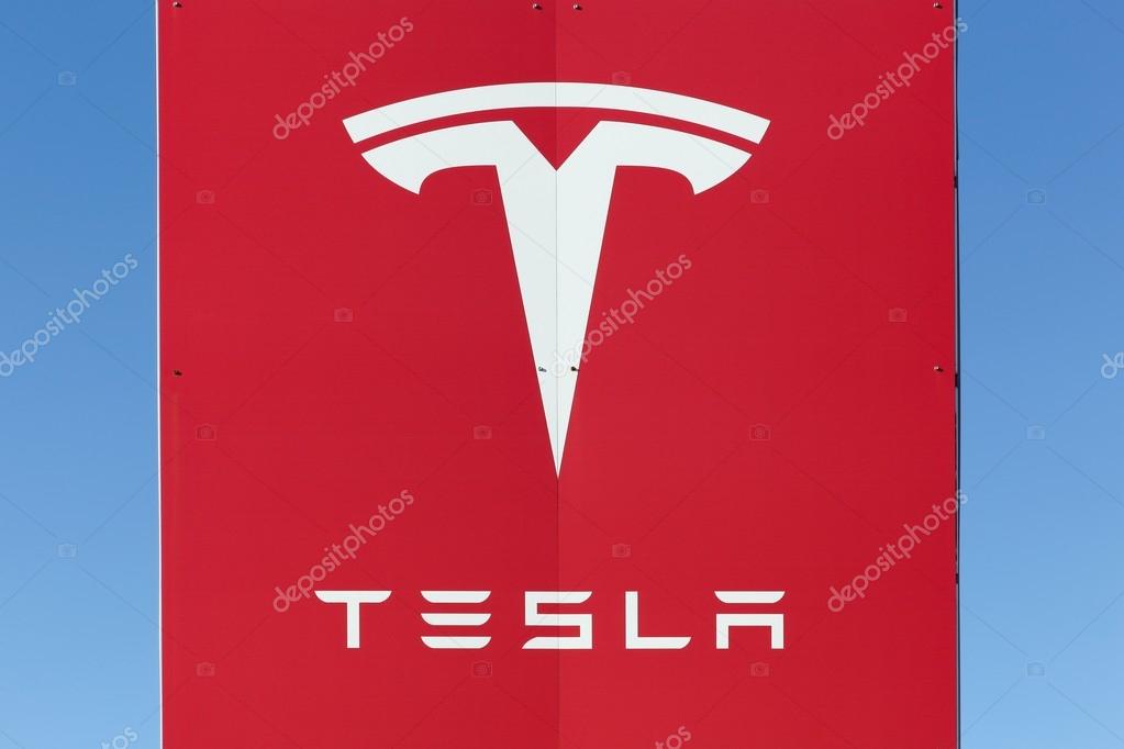 Aarhus, Denmark - February 13, 2016: Dealership sign of Tesla cars in Aarhus. Tesla is an American automotive and energy storage company that designs, manufactures, and sells luxury electric cars