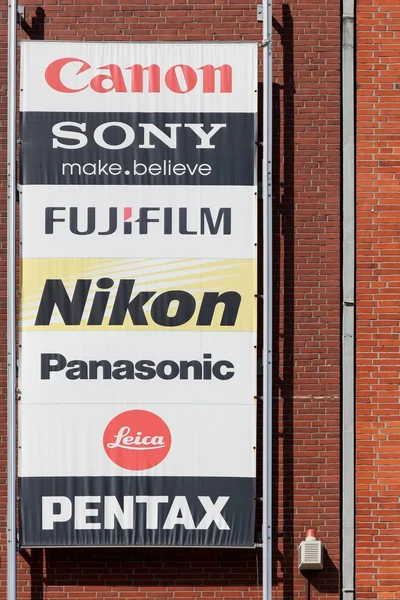 The main brands of the photography market on a wall of a store — Stock Photo, Image