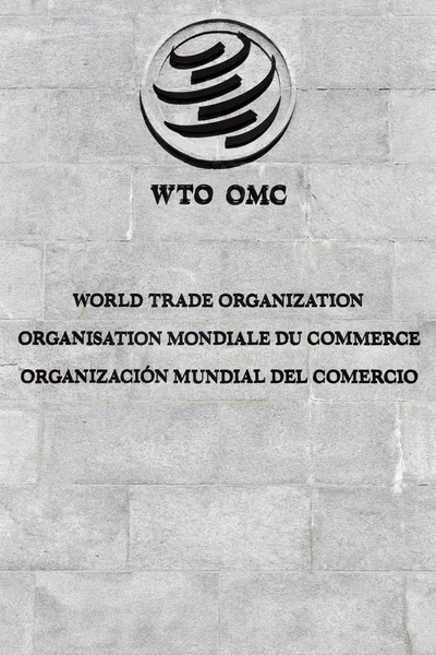 Het teken van de Wereldhandelsorganisatie (WTO) op een muur — Stockfoto