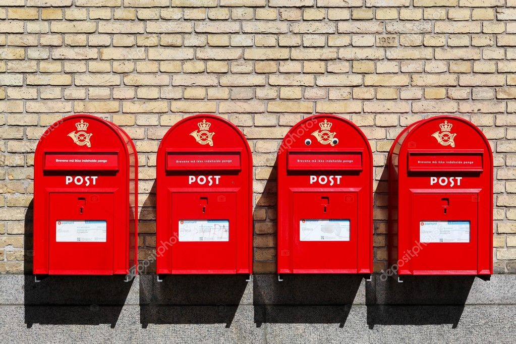 Red danish letterboxes on a wall