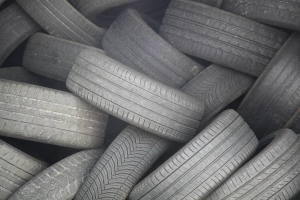 Old used car tires stacked