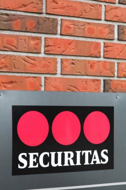 Horning , Denmark - July 18, 2019: Securitas logo on a wall. Securitas is a security services monitoring, consulting and investigation group, based in Sweden
