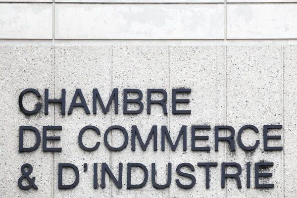 Chamber of commerce and industry sign in French language  on a wall