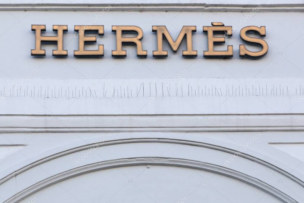Copenhagen, Denmark - April 2, 2019:  Hermes logo on a wall. Hermes is a French high fashion luxury goods manufacturer established in 1837