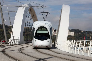 Tramway on a bridge near Confluence in Lyon clipart