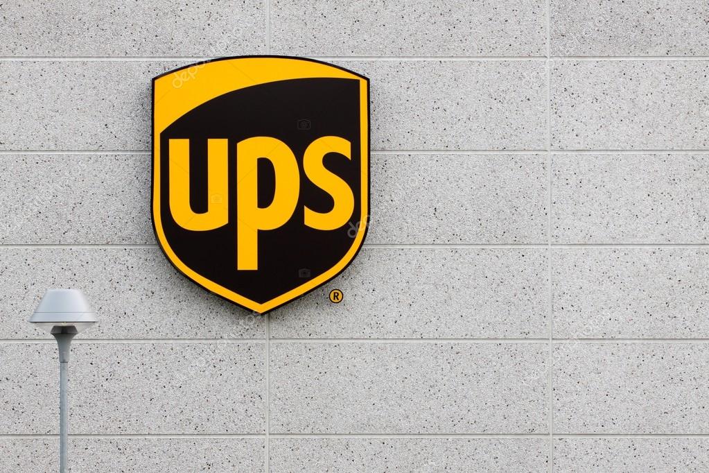 Vejle, Denmark - July 4, 2015: UPS logo on a facade.United Parcel Service is the world largest package delivery company and a provider of supply chain management solutions