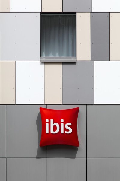 Ibis hotel logo on a wall