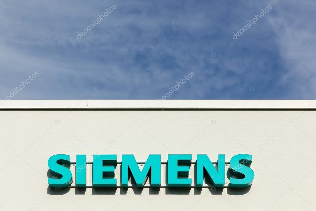 Aarhus, Denmark - August 8, 2015: Siemens logo on a facade. Siemens is a german multinational. It is the largest engineering company in Europe. The principal divisions of the company are industry, energy, healthcare, infrastructure and cities