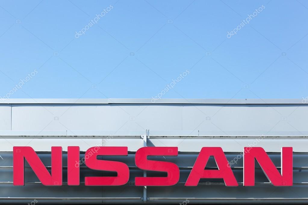 Aarhus, Denmark - August 22, 2015: Nissan logo on a facade. Nissan Motor Company Ltd, usually shortened to Nissan is a Japanese multinational automobile manufacturer headquartered in Nishi ku, Yokohama, Japan.