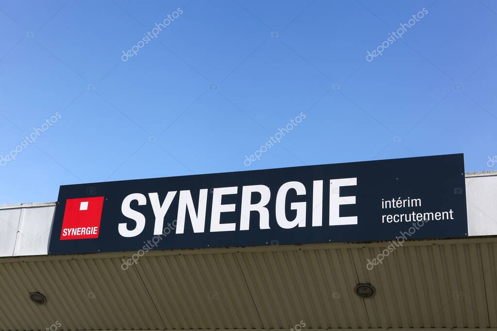 Belleville, France - October 6, 2024: Synergie logo on a building. Synergie is a French group specializing in the sectors of temporary work, recruitment and training