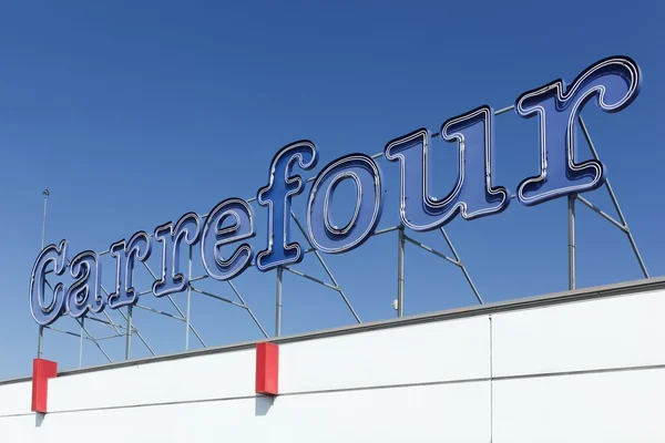 Carrefour sign on a facade of a hypermarket — Stockfoto