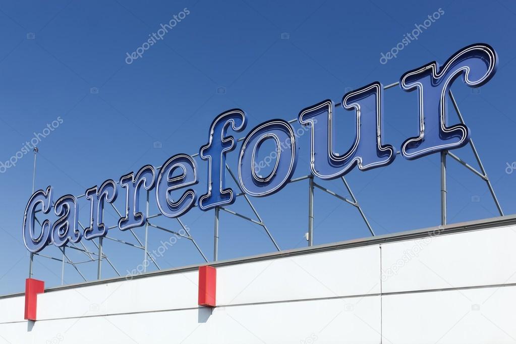 Macon, France - September 21, 2015: Carrefour sign on a facade of a hypermarket.  Carrefour is a french multinational retailer headquartered in France and it is one of the largest hypermarket chains in the world