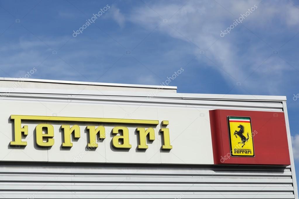 Lyon, France - September 25, 2015: Ferrari logo on a facade of a dealer.  Ferrari is an Italian luxury sports car manufacturer based in Maranello, Italy.