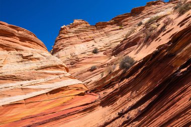 Kuzey Arizona 'daki Vermilion Cliffs Ulusal Anıtı' nın güneyindeki Coyote Buttes 'in güzel manzarası ve kaya oluşumları..