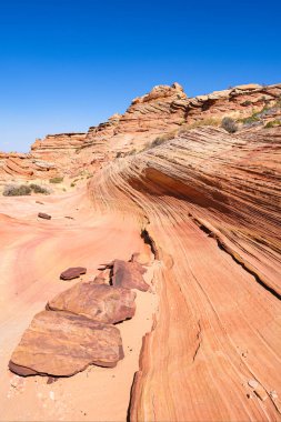 Kuzey Arizona 'daki Vermilion Cliffs Ulusal Anıtı' nın güneyindeki Coyote Buttes 'in güzel manzarası ve kaya oluşumları..