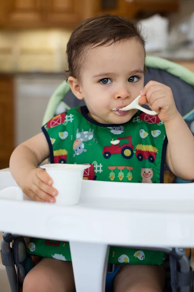 Hungry toddler eating — Stock Photo, Image