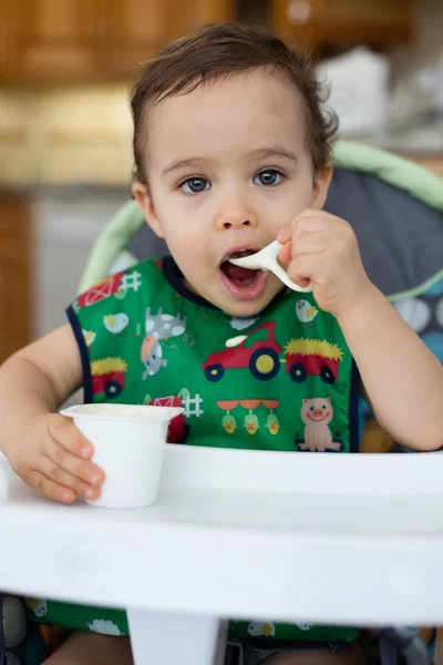 Hungry toddler eating — Stock Photo, Image