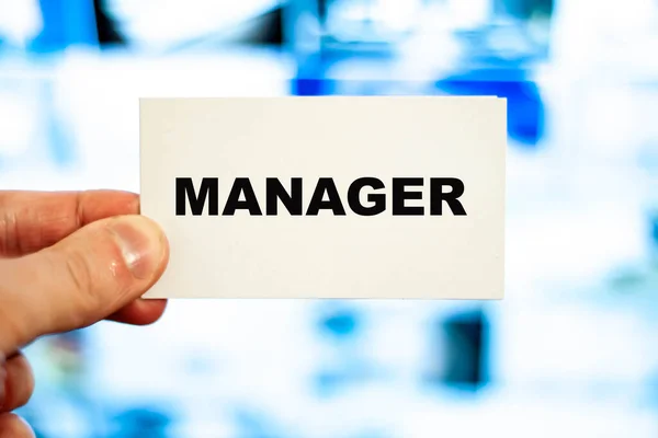 Business Manager Holds His Business Card Background Computer Monitor — Stock Photo, Image