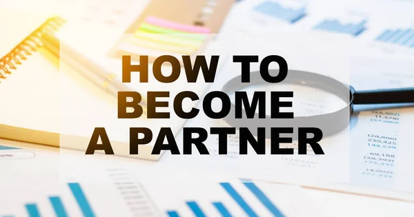 HOW TO BECOME A PARTNER question on financial papers with magnifying glass